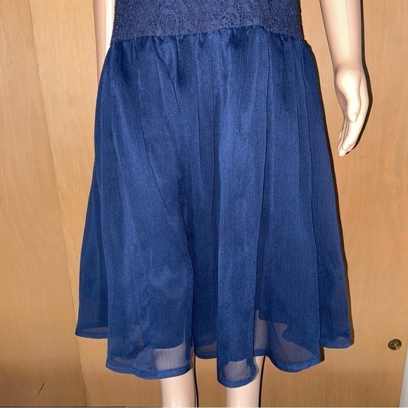 Guess Los Angeles baby lace dress has a gauze skirt just perfect for twirling. - Picture 6 of 8